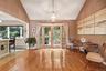 Dining area opens to kitchen and French doors to patio