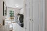 Spacious Laundry room with French Door to yard, double closets and door to 3-car garage