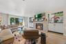 Family Room with sliding glass door to deck, recessed lights, wood burning Fireplace with marble surround, Wet Bar & B/I cabinets, Mother of Pearl acc