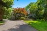 Set far back after the gated drive the approaching view of 6 Canterbury Court with 3 car garage