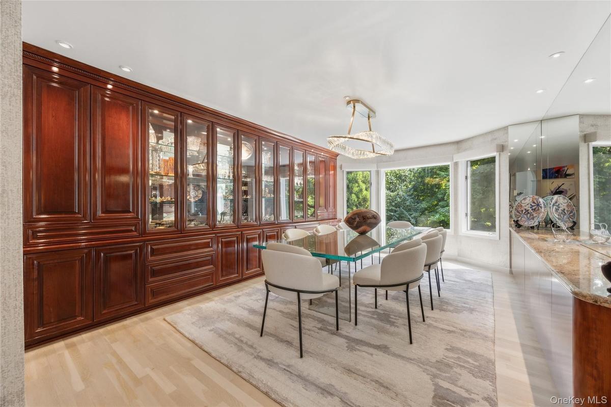 Dining Room with recessed lights, beautiful custom built credenza wall