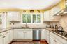 Kitchen - Bright Cabinets and Granite Counters