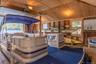 Misc room featuring plenty of natural light, wooden ceiling, wood-type flooring, and vaulted ceiling