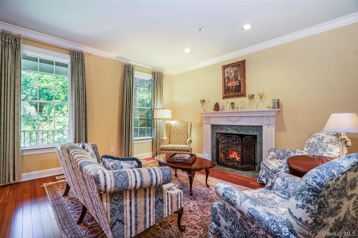 Light-filled and effortlessly inviting, this living room centers around a gorgeous wood-burning fireplace. Whether you're hosting friends or enjoying 