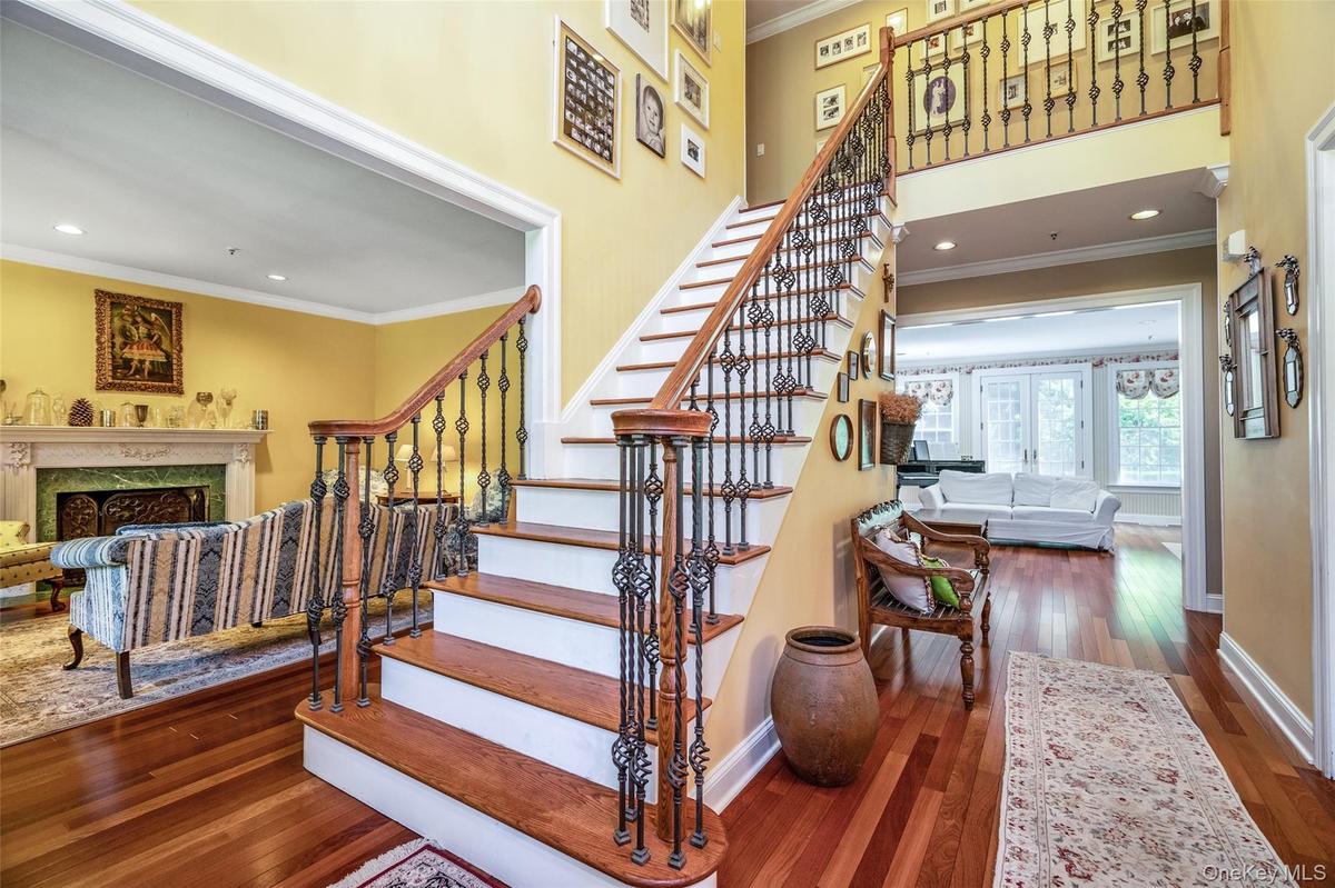 The grand, open foyer welcomes you with soaring ceilings and an airy feel that sets the perfect tone for the rest of the home.