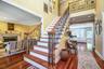 The grand, open foyer welcomes you with soaring ceilings and an airy feel that sets the perfect tone for the rest of the home.