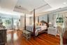 This primary suite is your own personal retreat. With elegant tray ceilings and a dedicated sitting area, it's the perfect place to reset after a long
