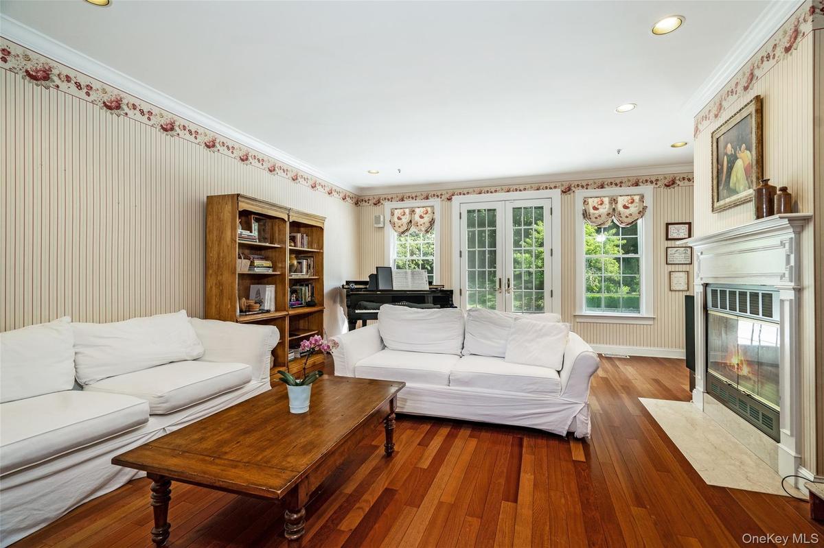 Designed for the way you actually live, this family room is where connection happens. The wood-burning fireplace adds instant ambiance, while the dire