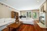 Designed for the way you actually live, this family room is where connection happens. The wood-burning fireplace adds instant ambiance, while the dire