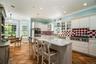 The heart of the home is light, bright, and ready for anything. With a chef-inspired island and elegant details, this kitchen flows seamlessly into a 