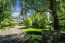 Tucked away off the street and enveloped by lush, beautiful gardens, this property offers an exceptional level of privacy.  Make it yours today!