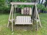 Freshly painted swing set in a spacious private backyard