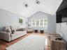 Bright and inviting with vaulted ceilings, exposed beams, hardwood floors, and plenty of natural light.