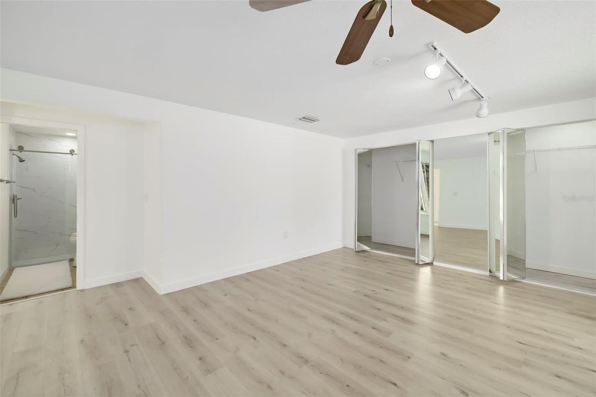 Primary with a remodeled full bathroom