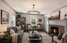 Modern take on the spaciousden with wood burning fireplace