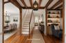 Beautiful entryway with exposed beams and wide pine floors