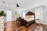 The primary suite features a large walk-in closet with an updated bedroom and en-suite bath (2022)