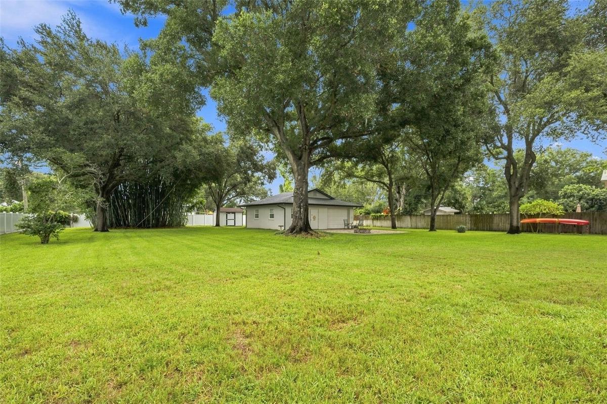 Tucked privately within the backyard, the air-conditioned detached structure with electricity is truly a standout feature of the property.