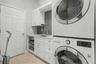 Beautiful Laundry room with sink and storage