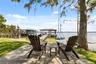 A private dock and boatlift provide immediate access to Lake Sheen and the entire Butler Chain, while a gated community boat ramp is approximately 300