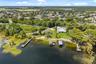 An exceptional opportunity to own one of the most compelling lakefront properties on Lake Cottage Lane, featuring an oversized homesite, expansive Lak