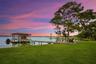 A private dock and boatlift provide immediate access to Lake Sheen and the entire Butler Chain, while a gated community boat ramp is approximately 300