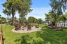 With no neighboring residence immediately on that side, the park creates an unusually open and private setting, allowing the lake, sky, and natural su