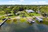 An exceptional opportunity to own one of the most compelling lakefront properties on Lake Cottage Lane, featuring an oversized homesite, expansive Lak