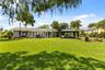 Lake Cottage Lane, featuring an oversized homesite, expansive Lake Sheen views, sandy shoreline, private dock and boatlift, and an existing 2BR/1.5BA 