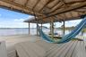 A private dock and boatlift provide immediate access to Lake Sheen and the entire Butler Chain, while a gated community boat ramp is approximately 300