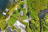 An exceptional opportunity to own one of the most compelling lakefront properties on Lake Cottage Lane, featuring an oversized homesite, expansive Lak