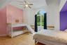Arched window, wood-finish flooring, ceiling fan, and built-in alcove