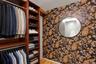 Custom built-in closet system with multiple shelving units and hanging rods