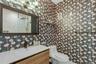 Modern vanity with an integrated sink and wood-finish cabinetry