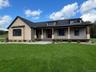 Photo of Home To Be Built - Picture of Existing Model used. Grass Retouched.