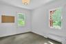 Now used as an office, this rear room, just next to the bathrooms and a large potential closet, could be a great first floor bedroom. With two exposur