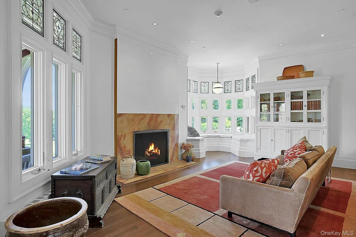 The front parlor is also a perfect den or library and is just off of the living room, but can easily be closed off by original smooth gliding double p
