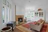 The front parlor is also a perfect den or library and is just off of the living room, but can easily be closed off by original smooth gliding double p