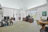 Behind the dining room is this massively convenient office space or library. Work from home takes on a somewhat different meaning when you can have a 