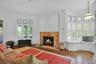This room has its own fireplace and plenty of space for seating. Restored stained glass windows over new, energy efficient ones perfectly capture the 