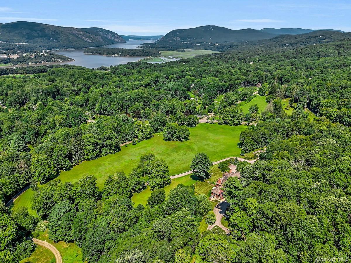 Perched in the verdant highlands along the Hudson River, the fields and rolling hills of this home are just minutes to the shore.