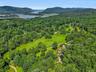 Perched in the verdant highlands along the Hudson River, the fields and rolling hills of this home are just minutes to the shore.
