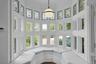 This cozy, bright bay window seat is an amazing spot to laze and read. The stained glass detail on the windows of the tower, which continues up to the