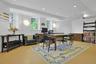 Also on the lower level, with large windows and an airy feeling, this would be a wonderful media room.