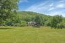 Taken from the driveway, this image captures the expansiveness of the grounds.