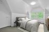 On the other side of the large upper level, another great space for a bedroom. This cozy room overlooks the front of the home.
