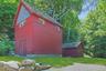This is a view of the large shed and the water tower building, which holds an eighteen foot high tower that contains all of the water this home could 