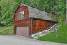 The guest cottage, atop the two car garage, is a perfect spot for both short and long term guests. The staircase on the right leads up to the entrance