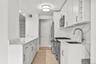 Custom white cabinetry for extensive kitchen storage