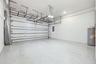 Oversized garage with high ceilings and overhead storage